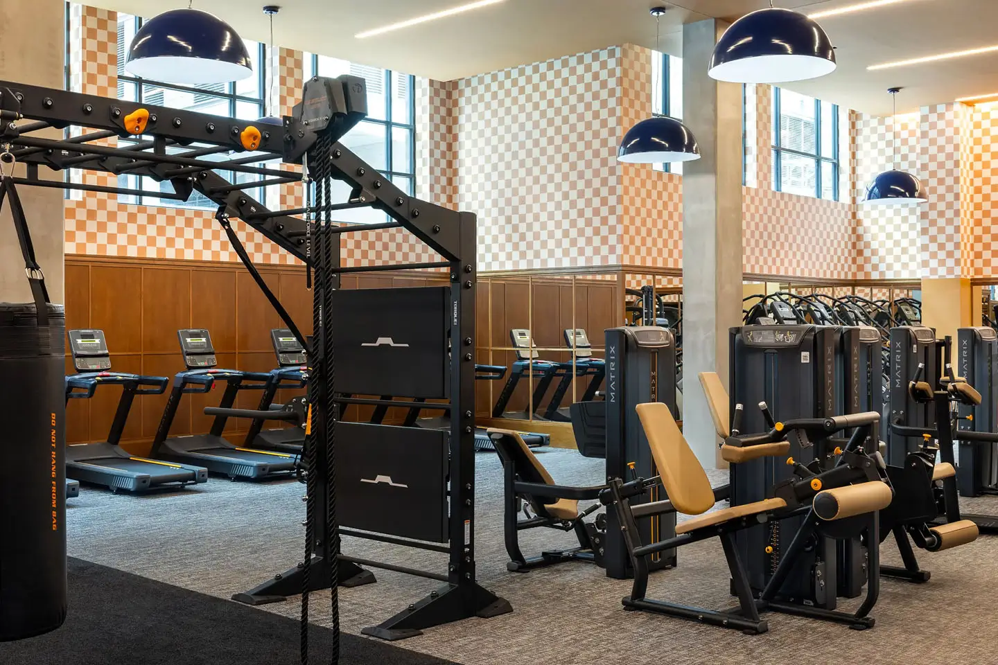 Classy apartment fitness centeer featuring a wide range of cardio and strength machines